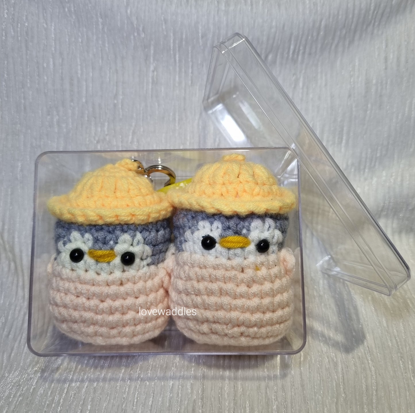 2 crochet penguin with keychains and 1 acrylic box